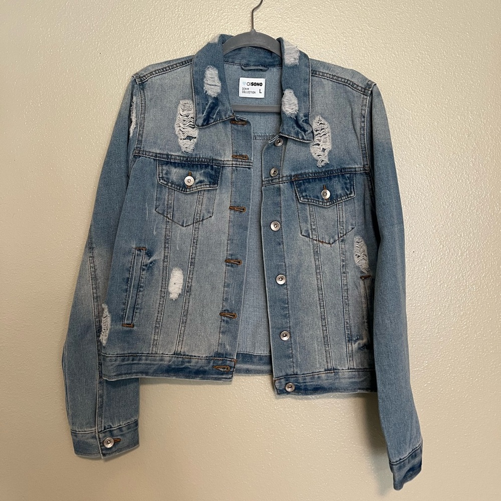 Distressed jean jacket, light-medium wash. Size large. Never worn